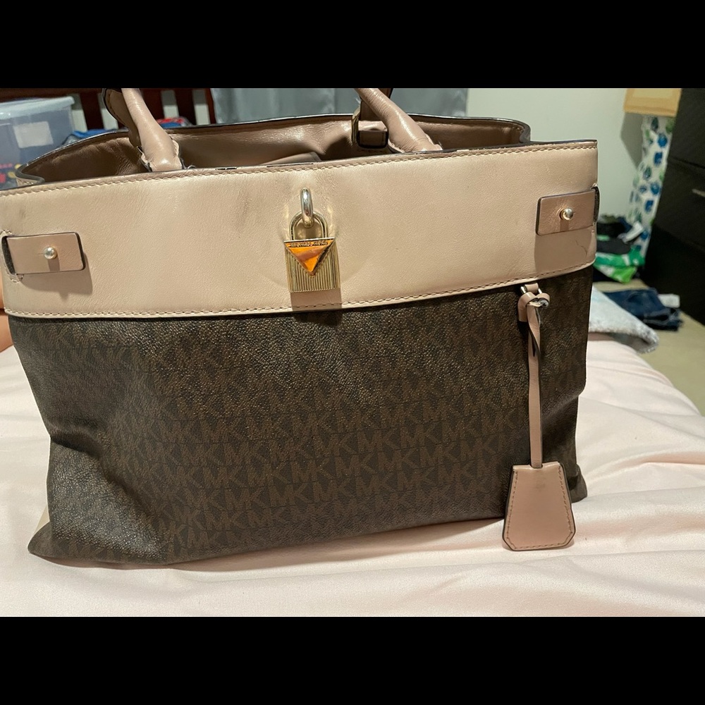 MK brown/pink Medium purse with cross body strap .